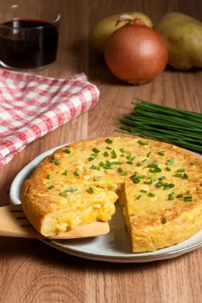 Tortilla de patatas a traditional spanish tapas served on a platter cut like pizzas