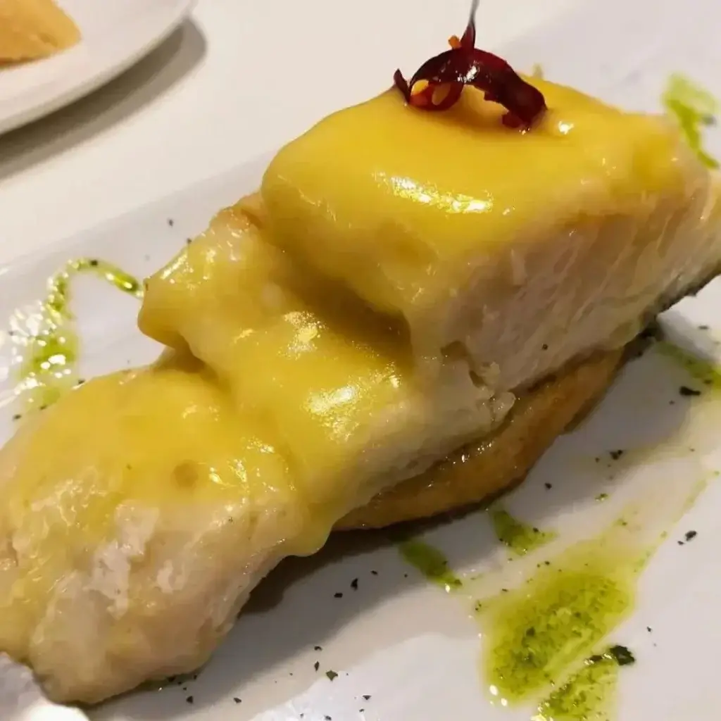 Pintxo de Bacalao Pil Pil a traditional pincho recipe served on a plate